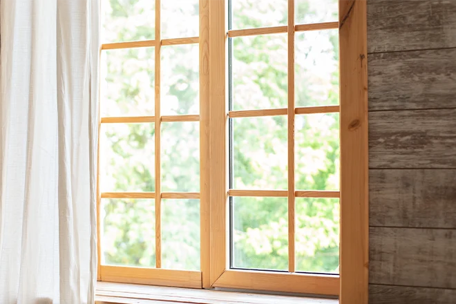 Wood window frame with white window treatment