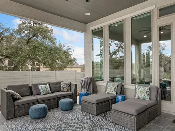 Stylish outdoor living with comfy seating and scenic view.